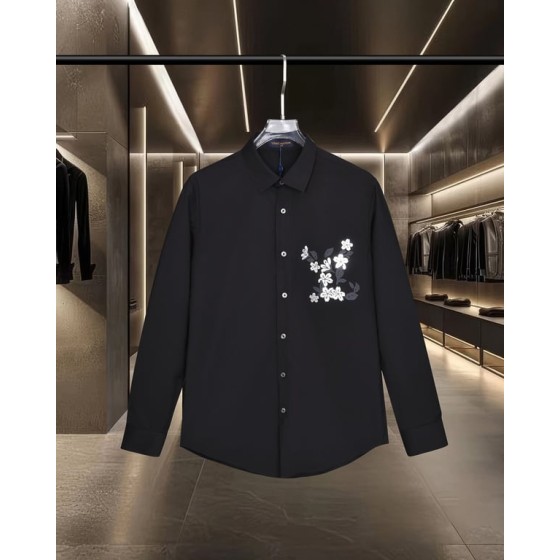 Louis Vuitton long-sleeved shirt with embossed floral logo in gold foil.